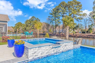 View of swimming pool with a fenced in pool, fence