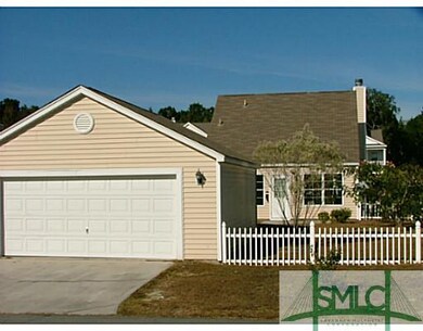 Exterior Back. Two car garage with rear entry