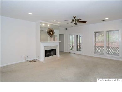 Large den with fireplace.....leading to the screen