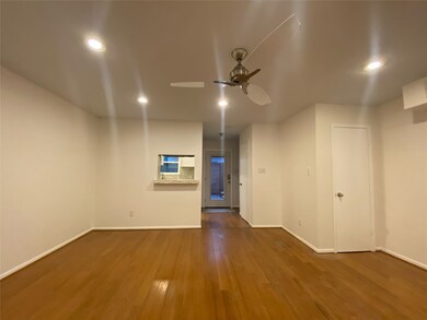 Downstairs features continuous bamboo flooring in this very versatile space that can be configured to be a dining and living area. 
