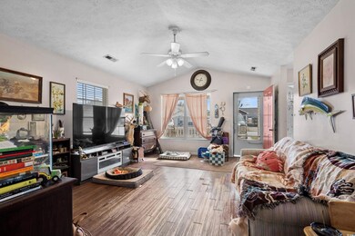 Living room with hardwood / wood-style flooring, c