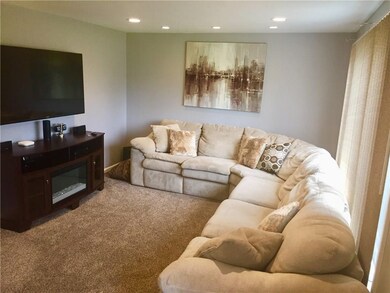 The living room, newer carpet