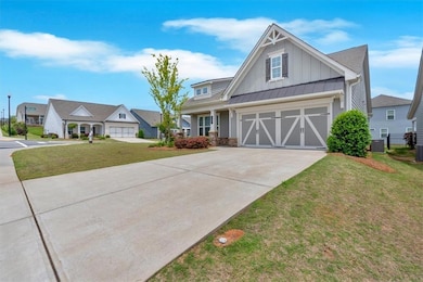 View of front of property with board and batten si