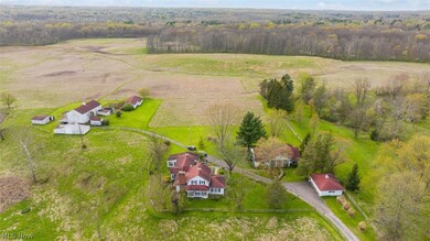 Birds eye view of property with a rural view