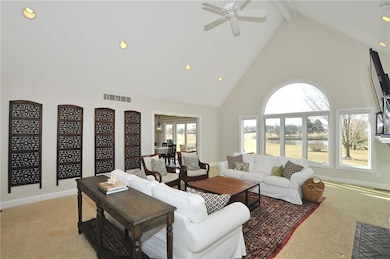 The open floor plans flows from the great room into the kitchen on the left. Check out the pond thru the great room windows - aha, you are home at last...