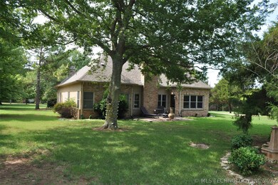 Back view of the house with great shade trees and