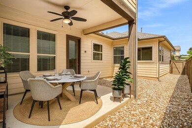 View of patio with a ceiling fan and outdoor dini