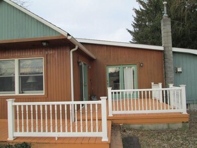 EASY ACCESS FROM INTERIOR OF HOME TO LARGE DECK FO