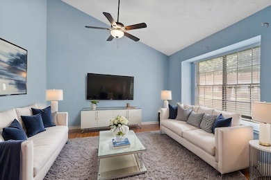 This inviting living room features soaring vaulted