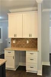 KITCHEN FEATURES A DESK WITH GRANITE TOP, SOFT CLO