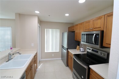 Kitchen featuring sink, light tile patterned floor