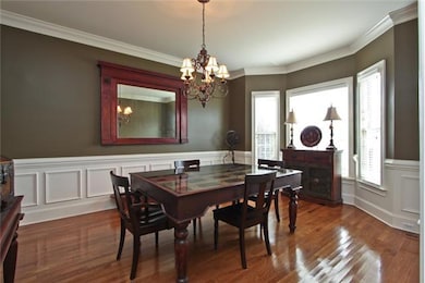 This spacious Formal Dining Room has new custom paint, trey ceilings, crown molding, wainscoting and butler's pantry with granite counter tops.  The Dining Room flows into the Kitchen and Great Room - perfect for entertaining.