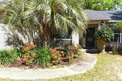 Front entry into home and flower bed