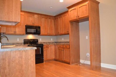 The Kitchen offers custom cabinetry by Henry's Cabinets, lots of counter space & a neutral color palette. 