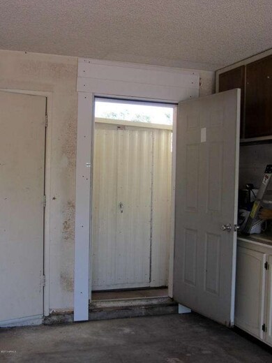 Door from garage leads to backyard shed