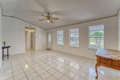 Entry Way View of Living Area and hallway leading to 3 bedrooms