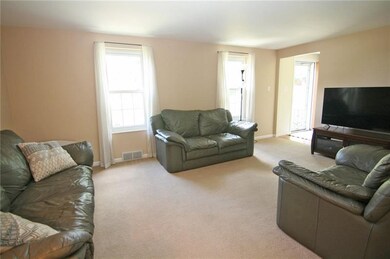 The large family room is warm and bright! The perf