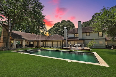 The modern style pool blends perfectly into the ba