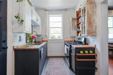Kitchen with butcher block counters.