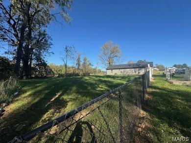 View of fenced backyard