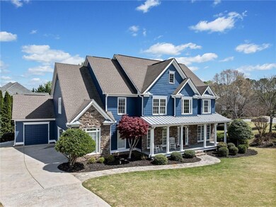 View of front of home featuring stone siding, an a