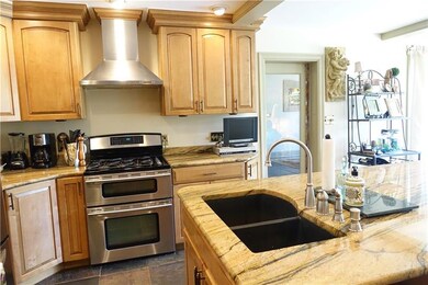 Remodeled Eat-in-kitchen with abundant cabinetry, 