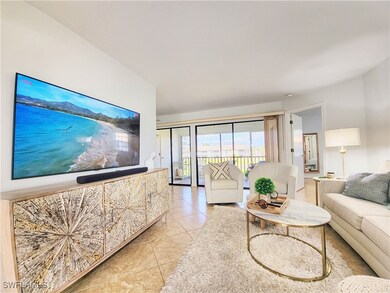 Living room featuring light tile patterned floors