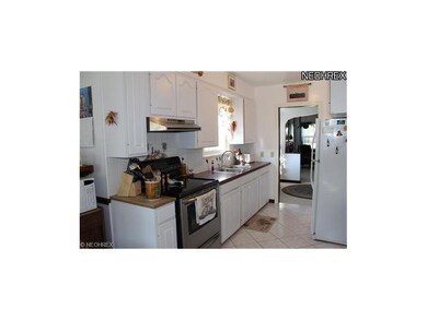Totally updated kitchen with tile floors in open t