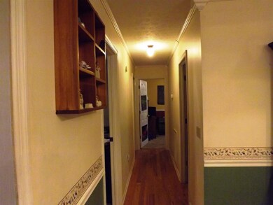 Hallway leading into Bedrooms, and Bath