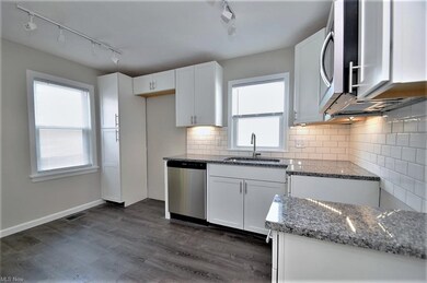 Stunning kitchen remodel includes granite counters