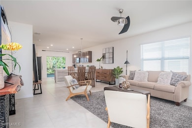Living room featuring ceiling fan