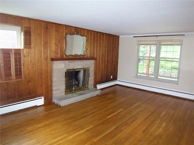 Cozy living room with log burning fireplace, prett