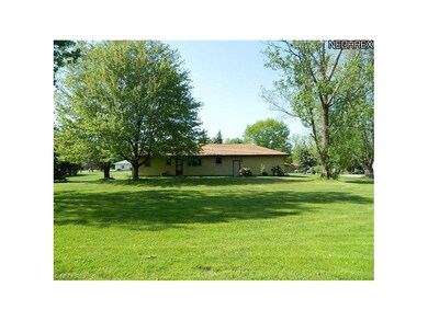Rear-view of Ranch-style home w/large manicured & 
