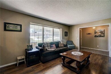 Roomy formal living space that is right of the ent