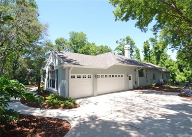 Oversized 3 car, side entry garage with large driv
