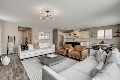 Living area featuring a chandelier, light wood fin