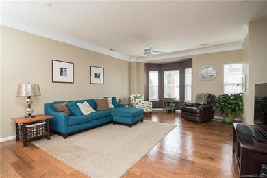 HUGE great room features gleaming, hand-scraped wa
