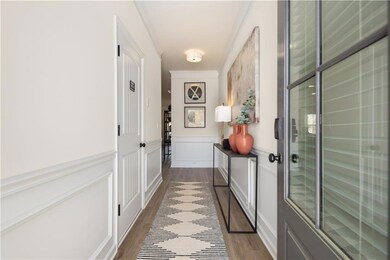 Doorway to outside with dark wood-style flooring, 