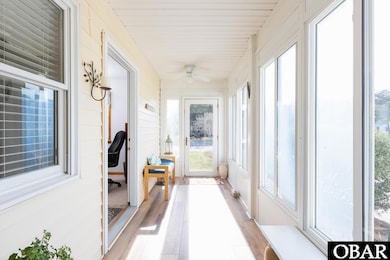 Enclosed entry porch has two interior entrances