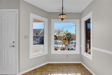 Light neutral paint with white trim for a clean open feel.