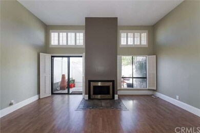 Light, Bright Living Room with Fireplace and Plant