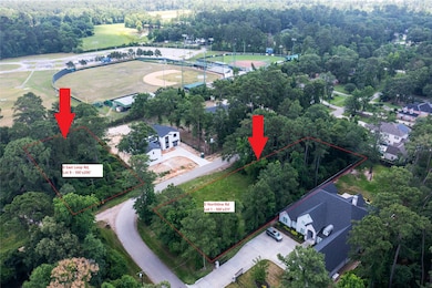 The corner lot across the street is also for sale.