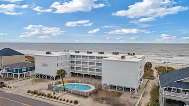 Aerial view with a beach view and a water view