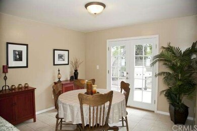 Dining area opens through double French doors to t
