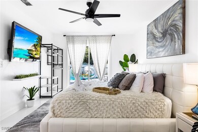 Bedroom featuring ceiling fan and access to exterior