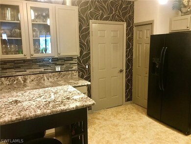 Entry to kitchen from garage. Deep pantry to the l