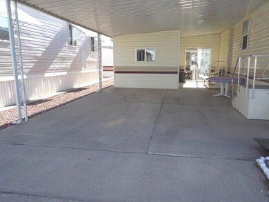 SPACIOUS OUTDOOR LIVING CARPORT