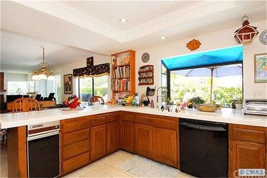 KITCHEN OPENS TO FAMILY ROOM