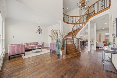 Step inside to a breathtaking foyer with soaring c