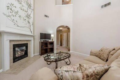 Light-filled foyer with a cozy fireplace